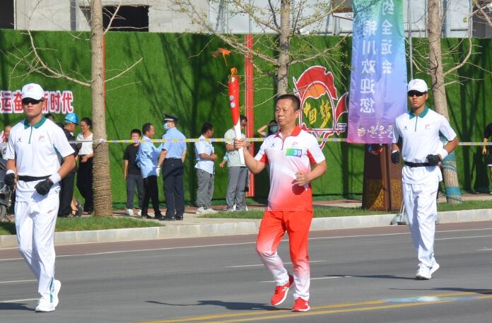 助力十四运！陕西省福彩中心参加火炬传递活动